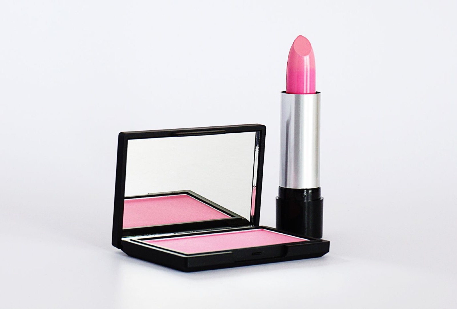 An unbranded lipstick and blush compact